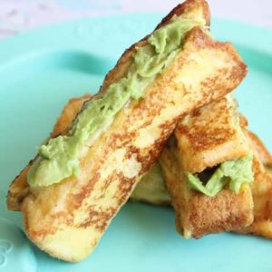 plate of two grilled avocado cheese sticks