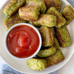 broccoli tater tots on a plate with ketchup dipping