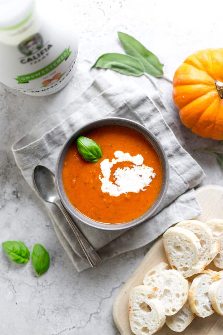 Bowl of soup with pumpkin for decor