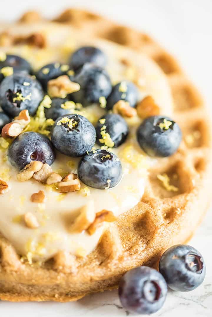 Close up of waffle with coconut blueberry crumble topping