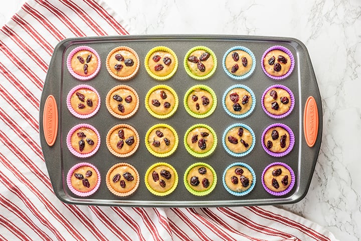 Muffin tin with silicone liners and cranberries