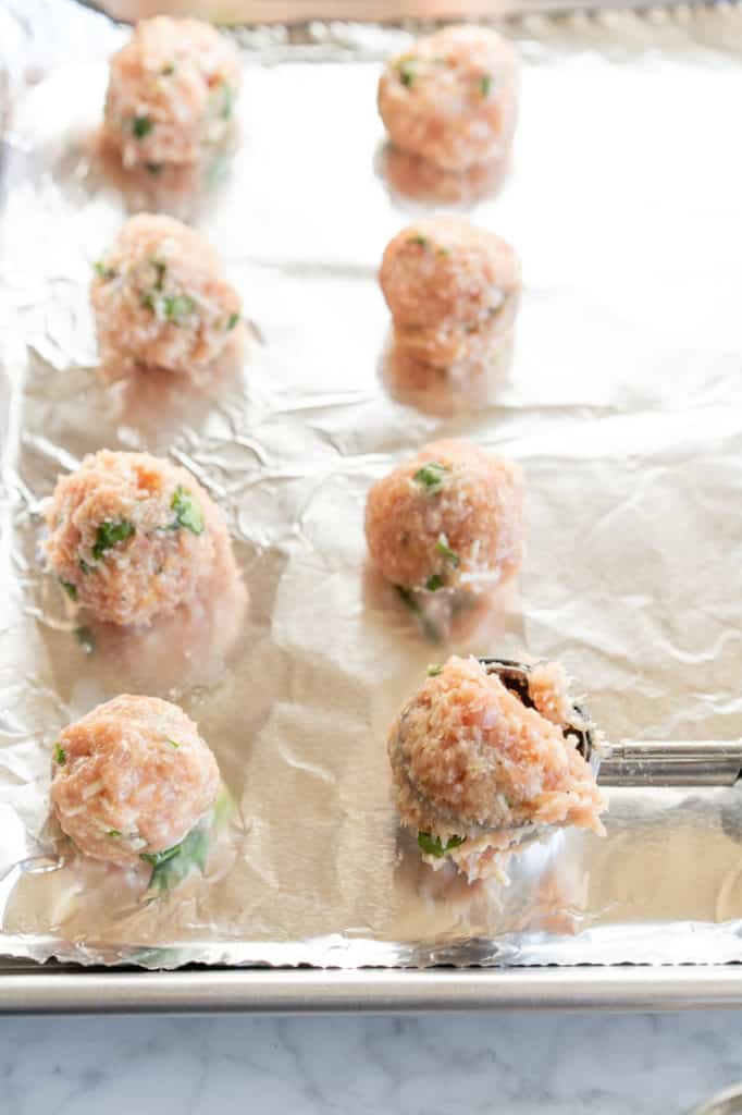 Chicken meatballs uncooked with cookie scoop