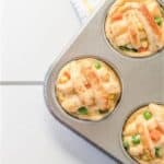 Close up of three mini pies in a muffin tin