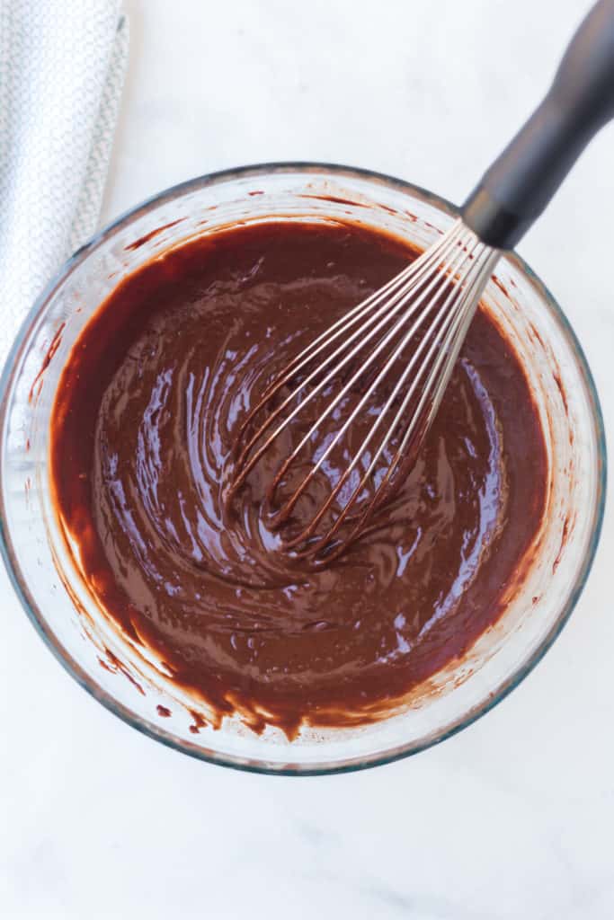 Bowl of chocolate with whisk