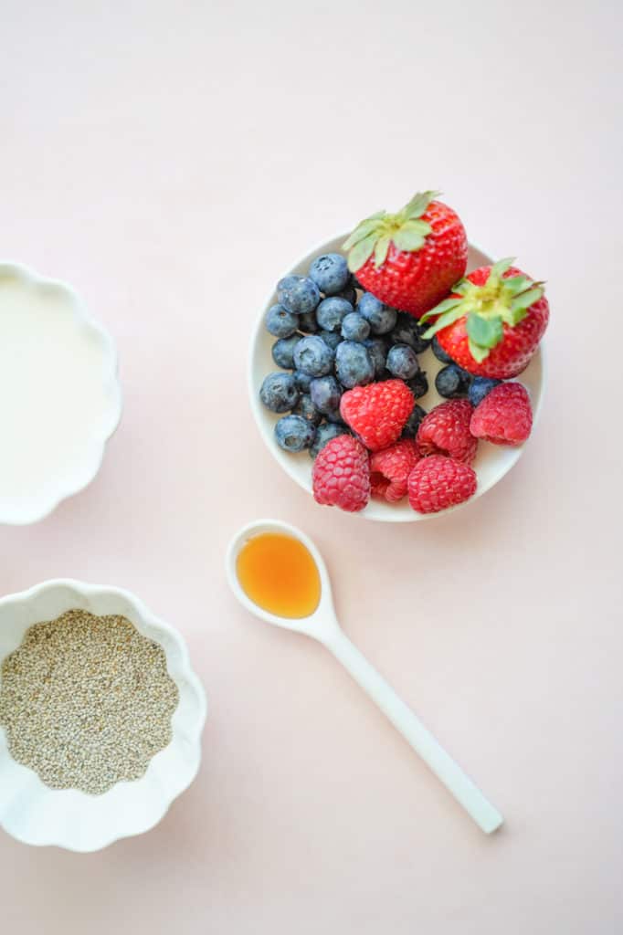 Bowl of fruit, bowl of milk, honey and chia seeds