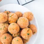 Bowl of sweet potato balls with marinara on the side