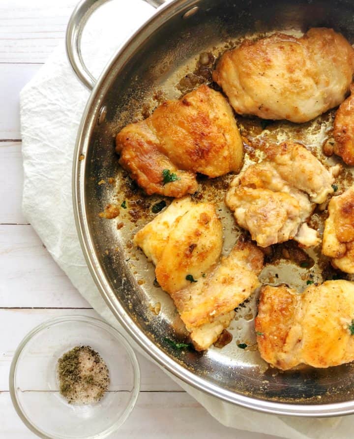 Pan with browned chicken 
