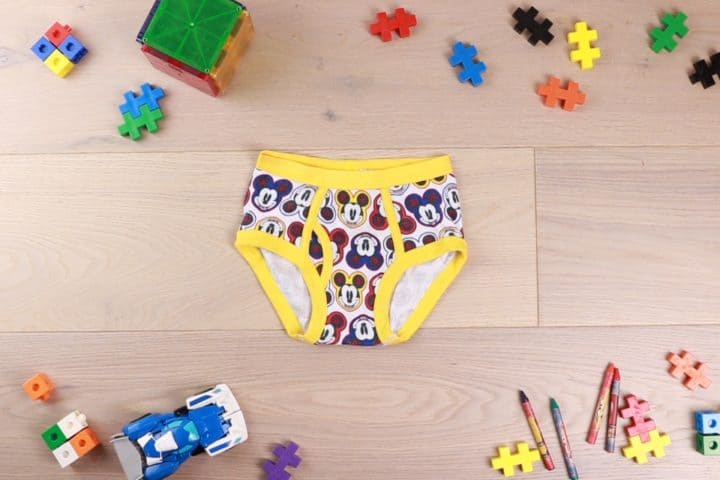 Mickey mouse underwear surrounded by toys as decor 