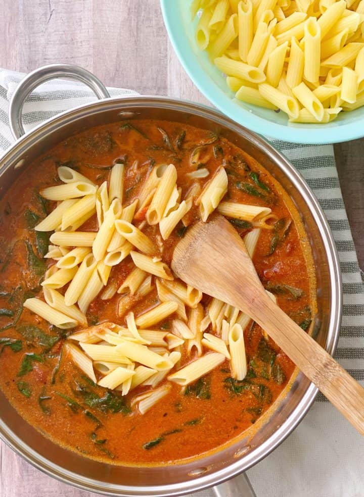 Pan of pasta and tomato cream sauce 