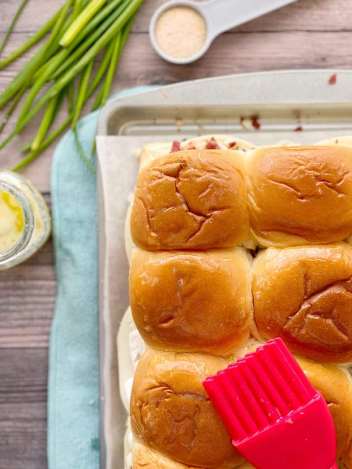 Hawaiian Rolls with red pastry brush on top 