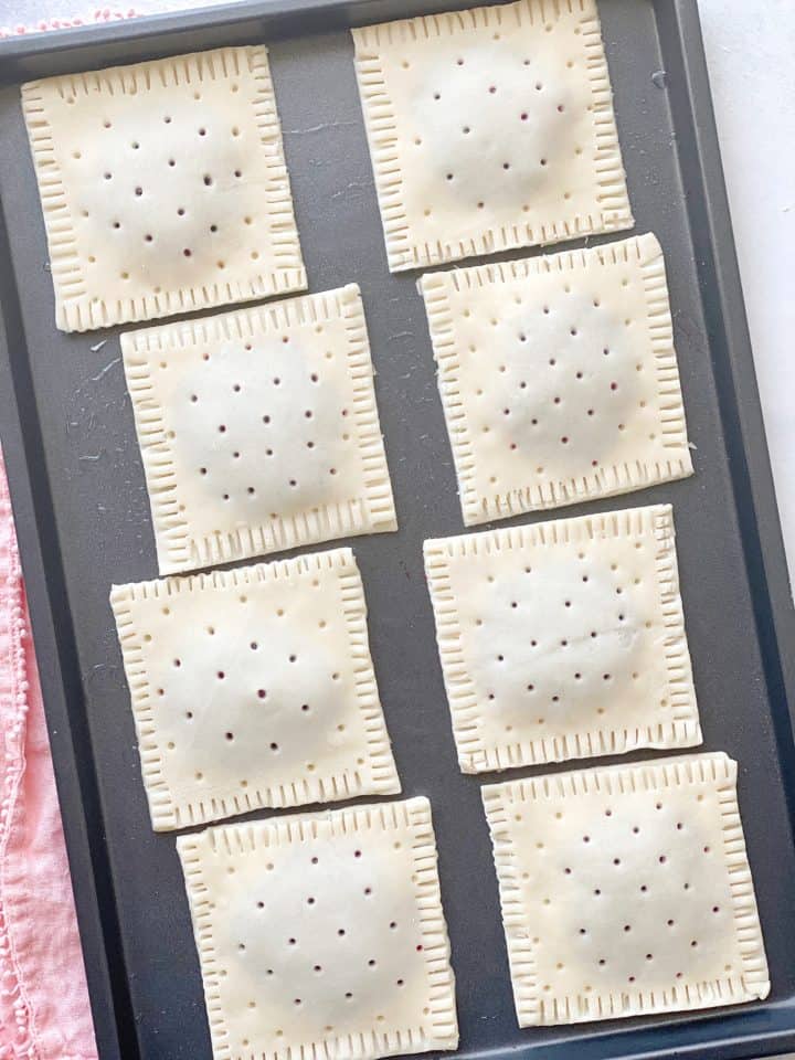 prepared pie tarts on a baking sheet 