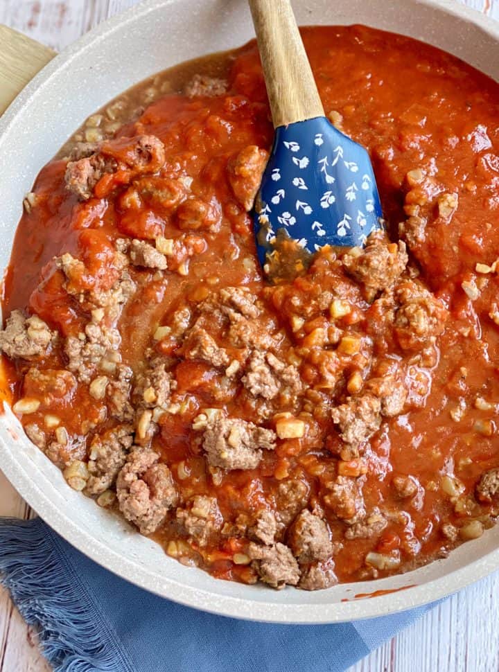 Red sauce with ground beef and cauliflower in a skillet 