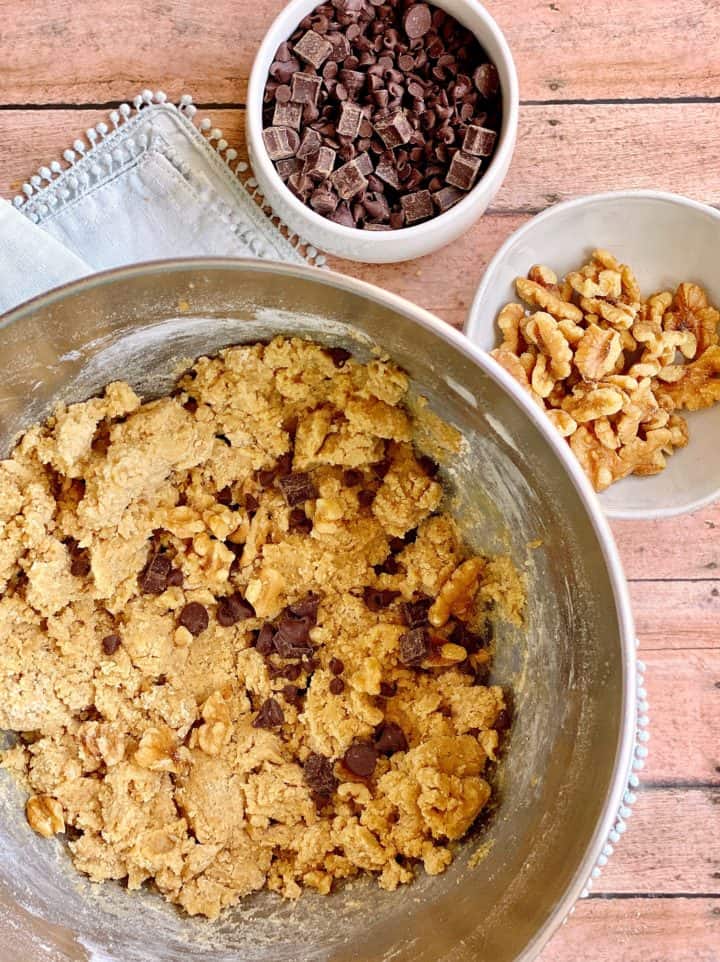 Cookie Mixture with chocolate chips and walnuts on the side 