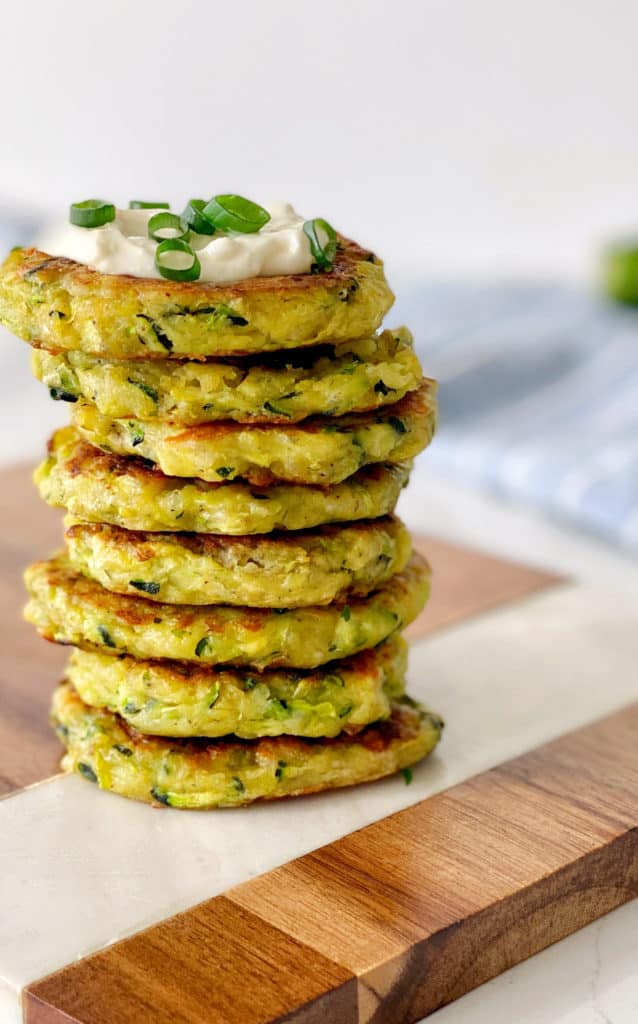 veggie patties stacked on a wooden board 
