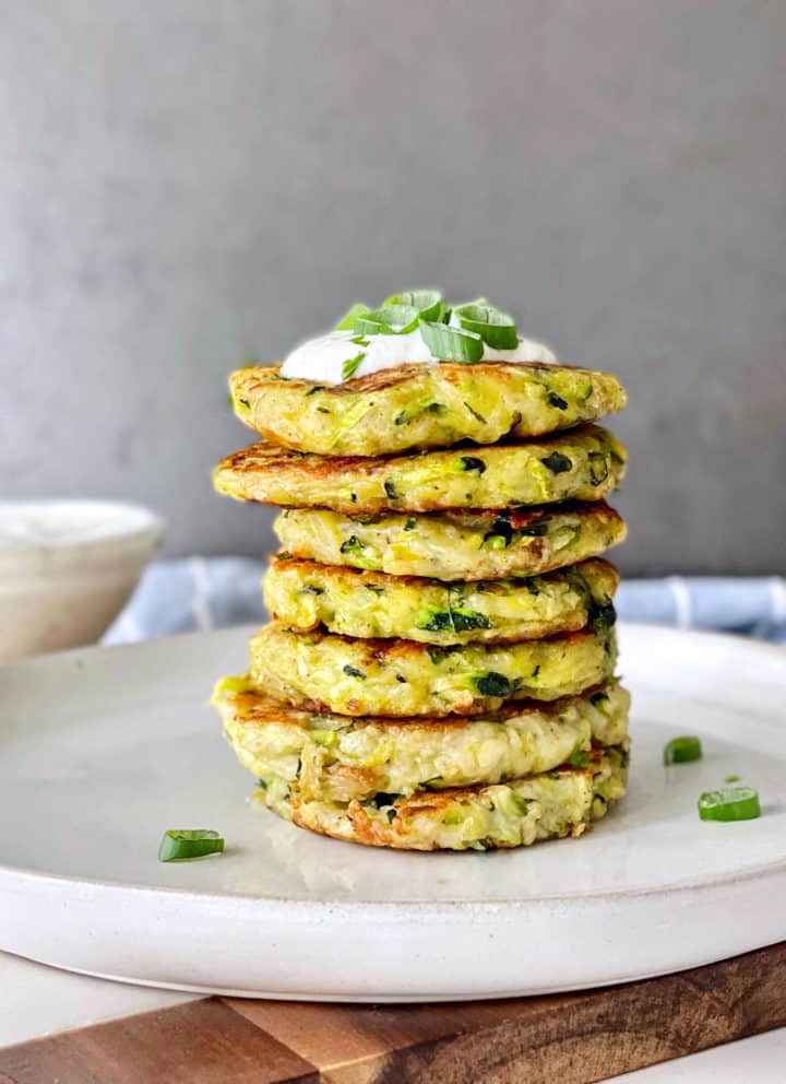 stack of veggie nuggets with sour cream and scallions on top 