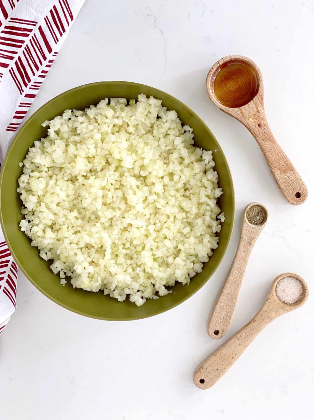 cauliflower rice in pan with seasonings 