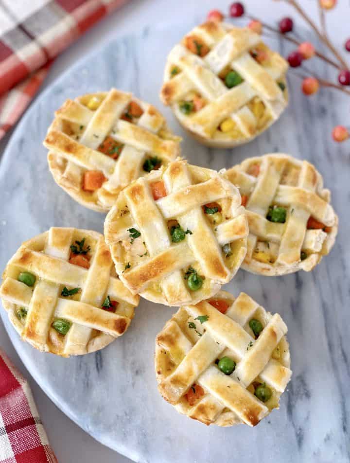 close up of mini pot pies on a marble tray