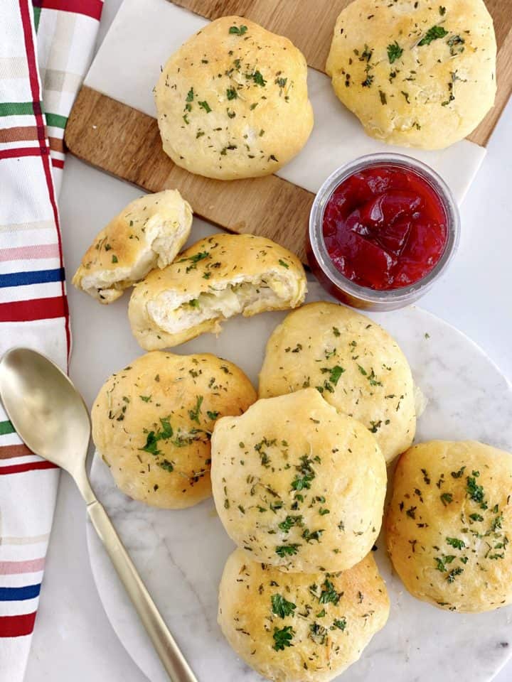 rolls on a tray with marinara sauce 