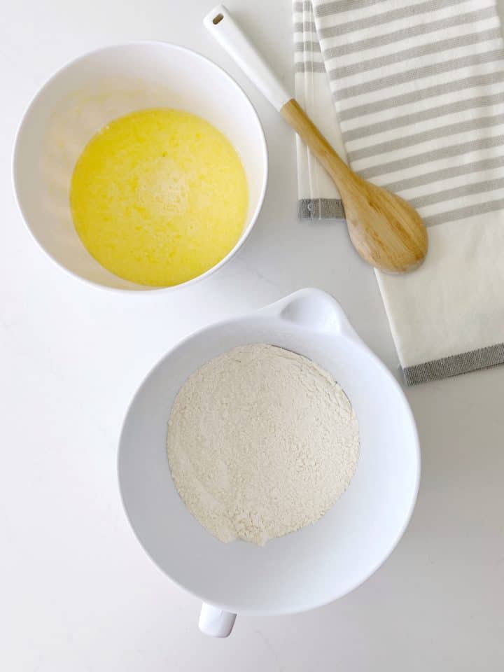 bowl with egg mixture next to flour mixture 