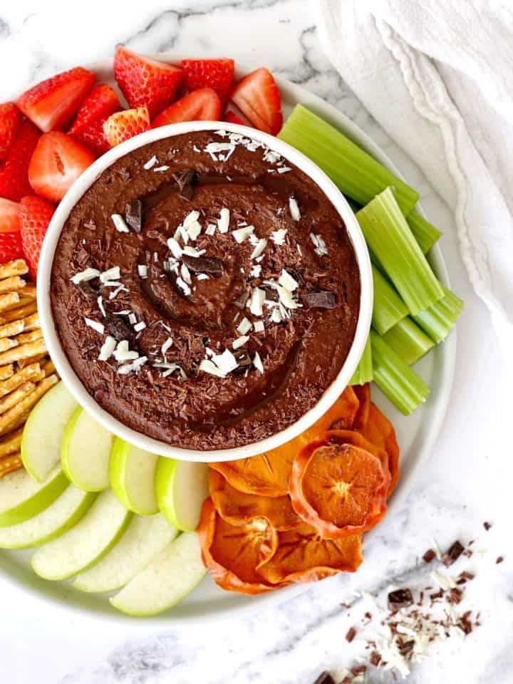 close up of vegetables and fruit with chocolate hummus dip 