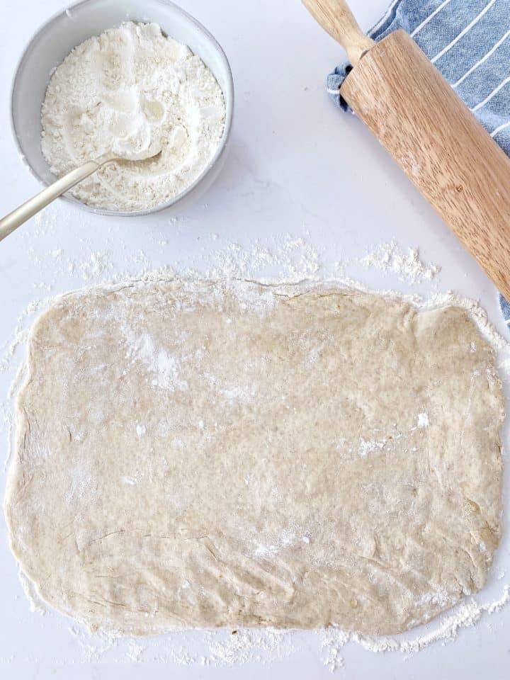rolled out dough with rolling pin 
