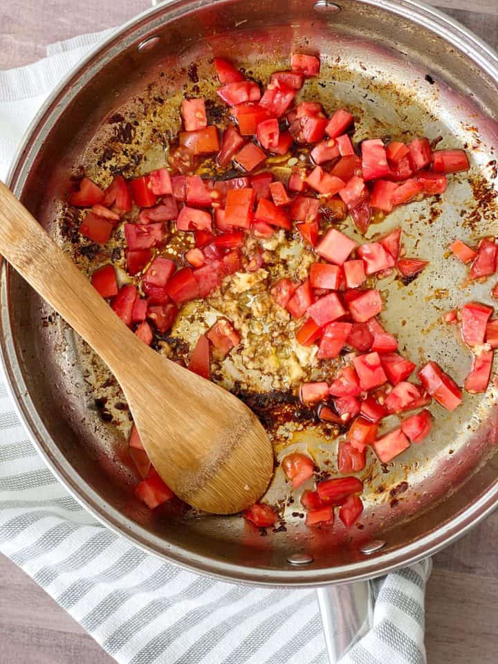 pan with diced tomatoes and minced garlic 