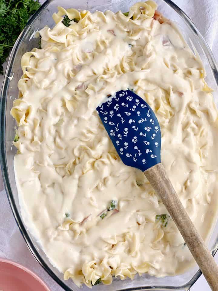 casserole dish with sauce over pasta 