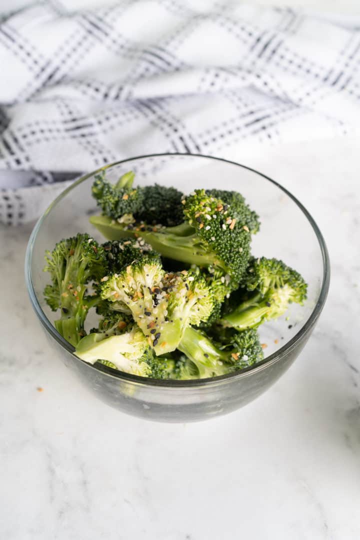 bowl of broccoli with olive oil and seasnings