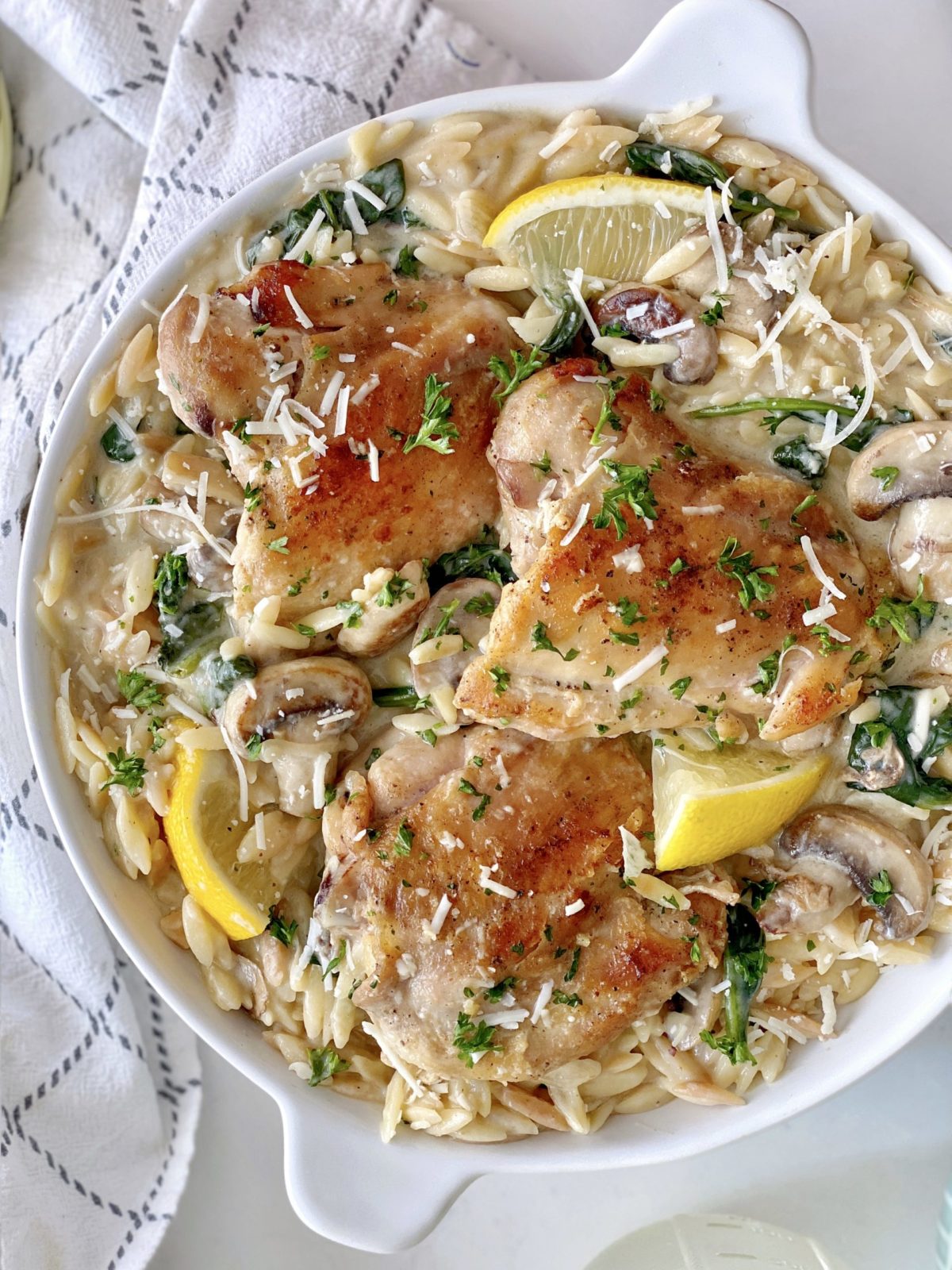 plate of orzo and chicken with toppings in a bowl 