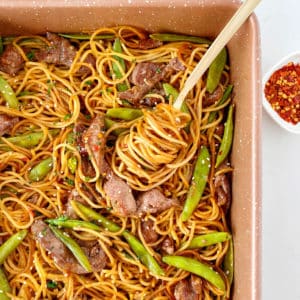 pan with noodles snow peas and beef