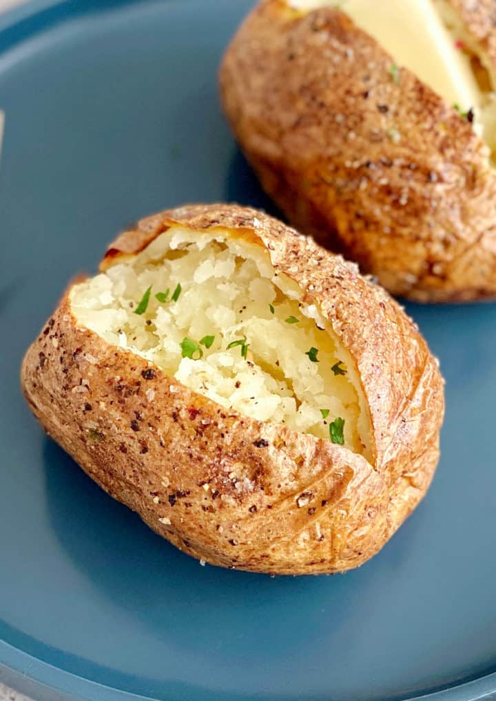 close up of baked potato with chives 