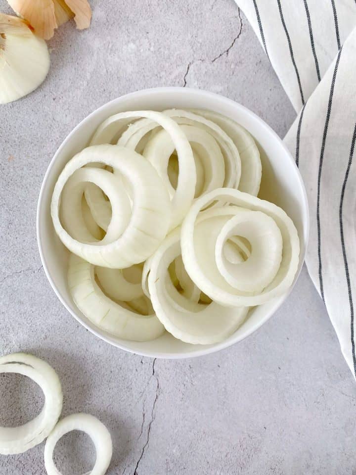 cut up onion rings in a bowl 