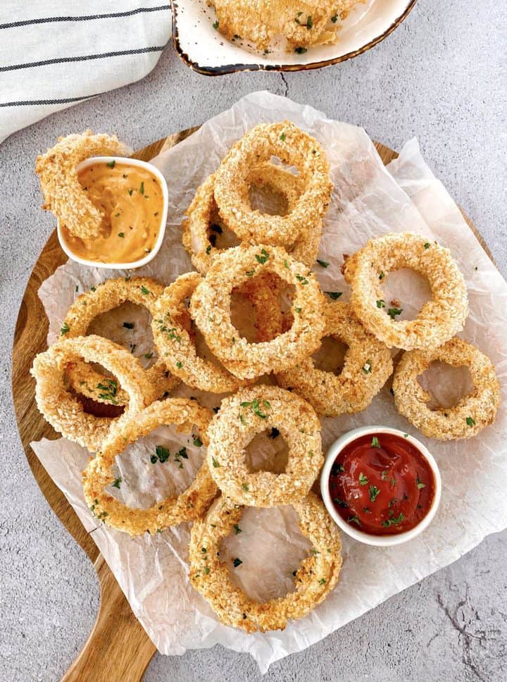onion rings on a plate with ketchup 