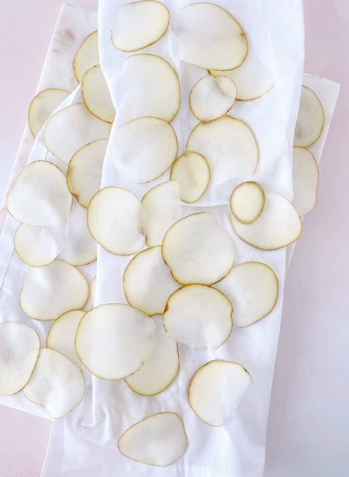 slices of potato on a paper towel