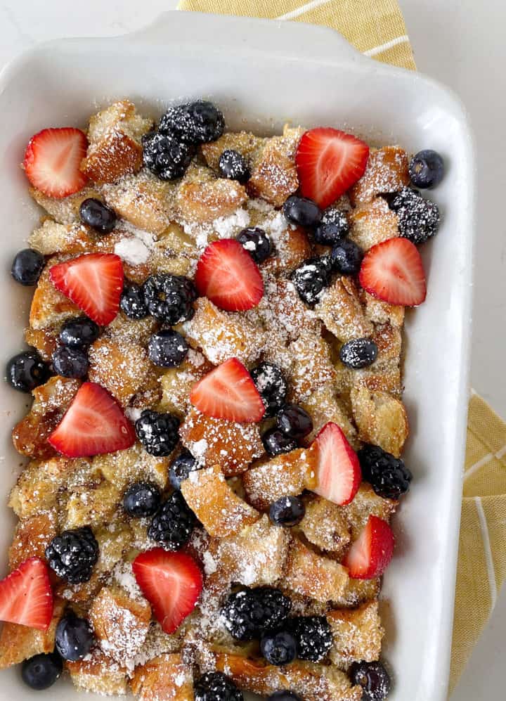 french toast in a pan with berries
