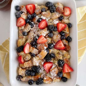 baked french toast in a casserole dish with berries