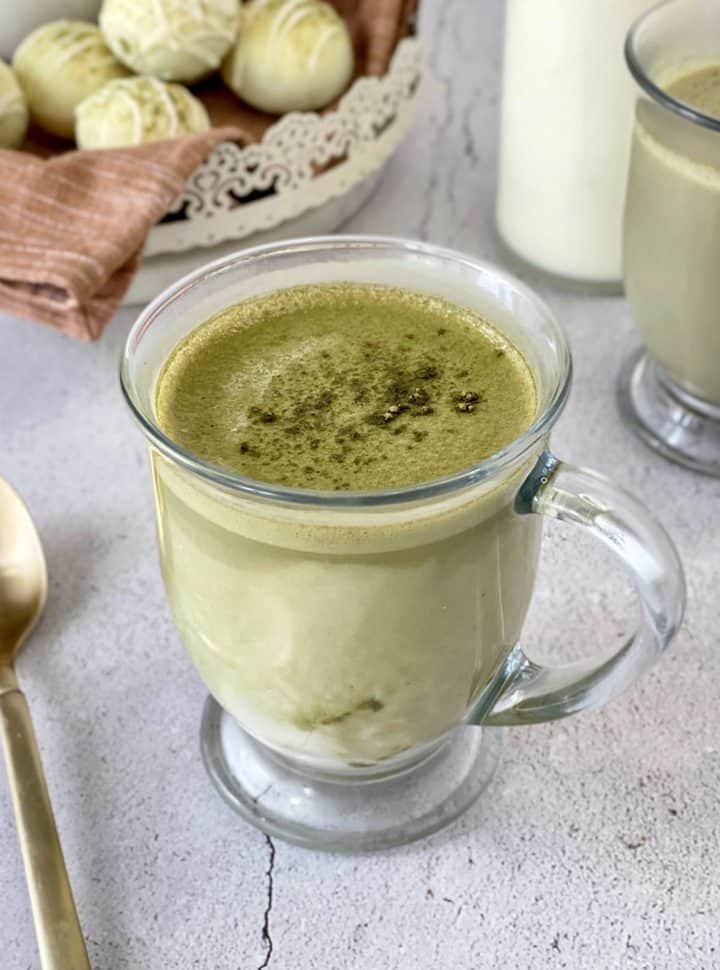 cup of green matcha latte in a mug 