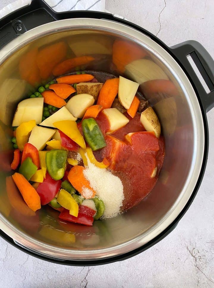 instant pot with vegetables tomato sauce and sugar