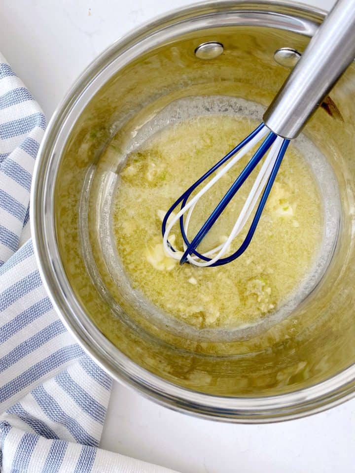 pot of butter with a whisk 