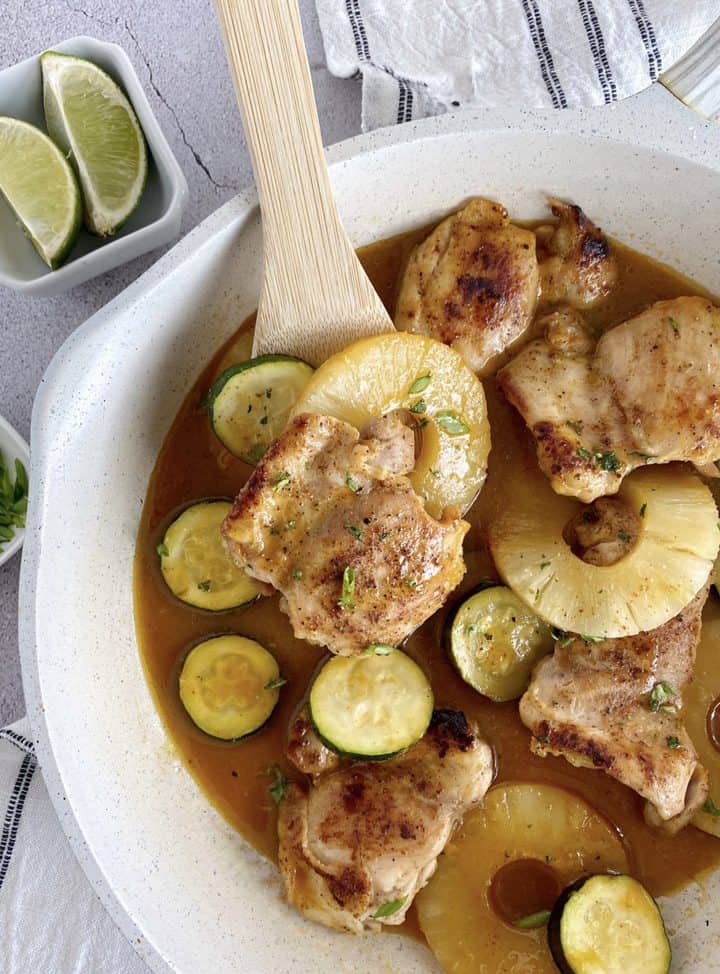 pan of chicken with pineapples and zucchini 