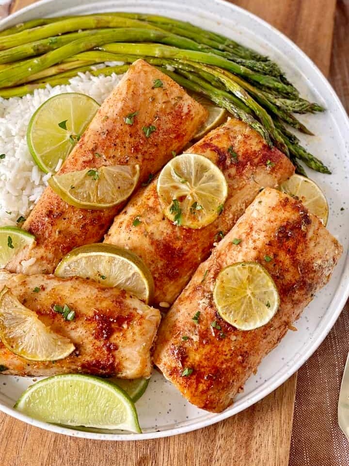 mahi mahi with rice on bottom with asparagus