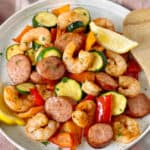 bowl of cajun shrimp and veggies with sausage