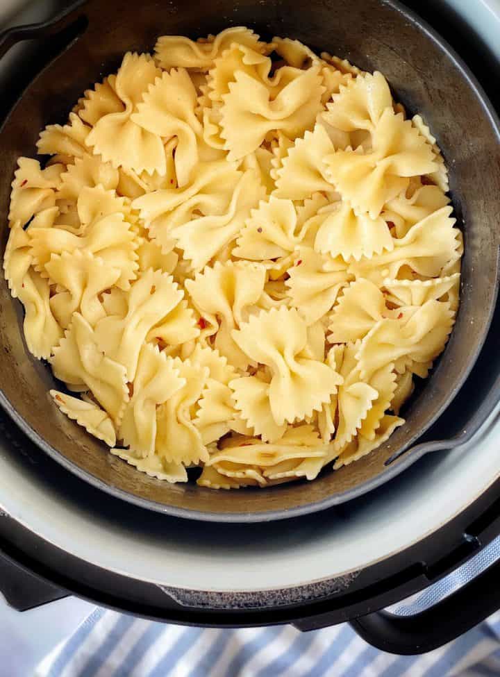 bowl of cooked pasta in an air fryer 