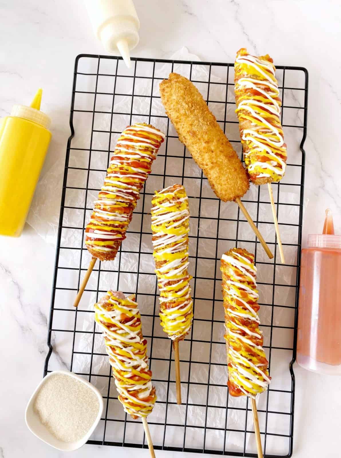 korean corn dogs on a wire rack