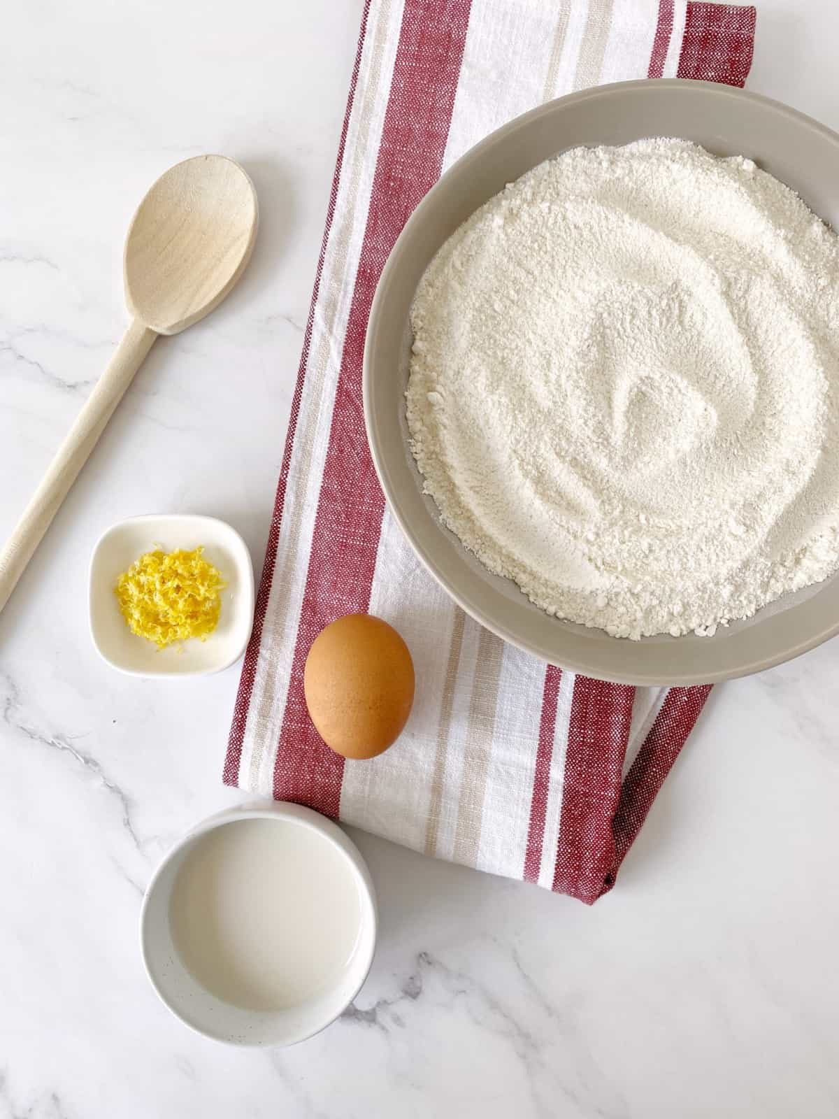 bowls of flour, egg and baking powder