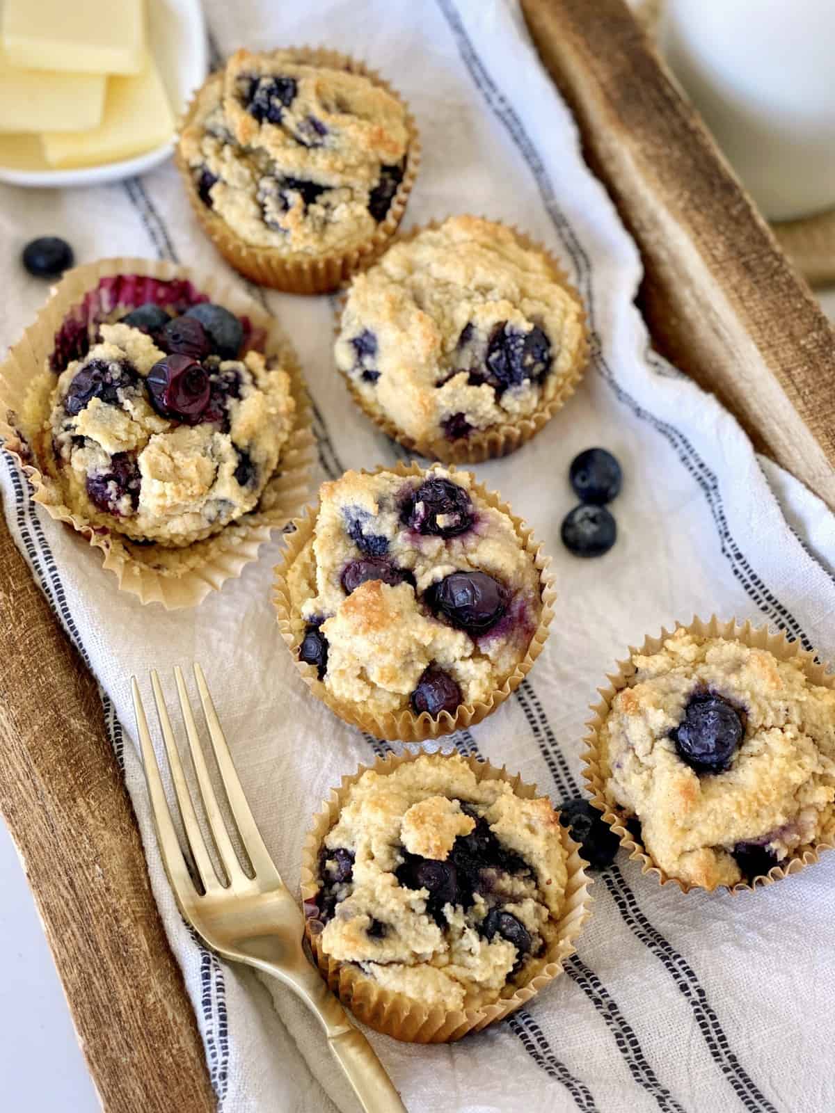 blueberry muffins on a towel 