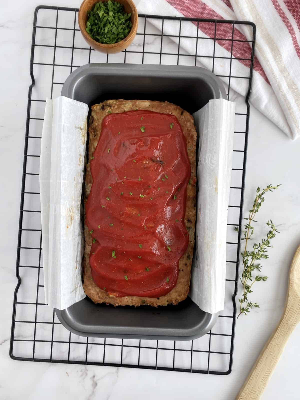 meatloaf with sauce in a baking pan