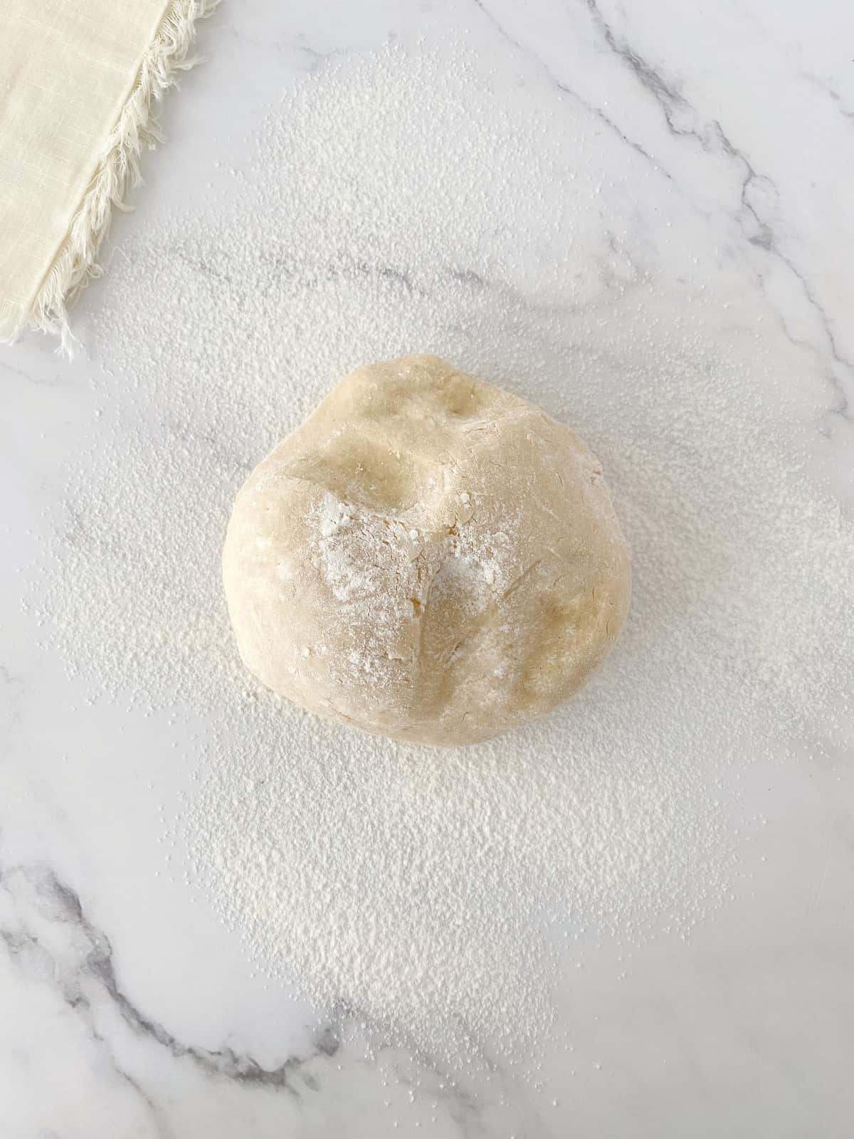 ball of dough on a surface 