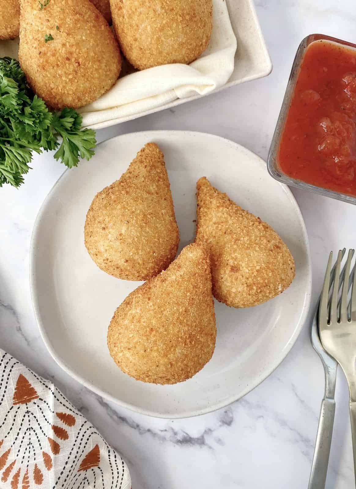 coxinha on a plate next to ketchup