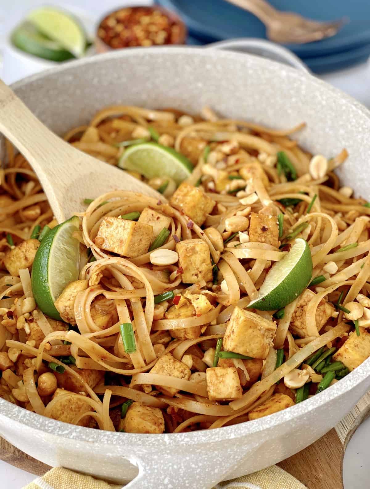 close up of thai noodles with wooden spoon 